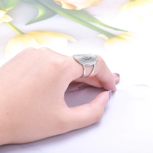Silver vintage ring featuring an oval spiral texture with a double-layered open band style