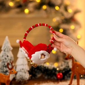 Close-up of Santa Claus plush earmuffs with red striped headband and festive bells