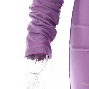Detailed macro view of purple knit fabric texture and pleated cuffs on slim-fit dress