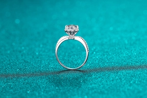 Detailed view of 1 carat moissanite ring with six-prong setting and heart-shaped base