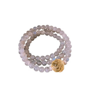 Three-layer moonstone beaded bracelet with a textured golden rose sphere pendant