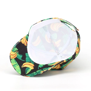 Banana print baseball cap with yellow and green patterns on black fabric background