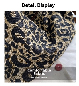 Close-up of thick leopard print jacquard fabric with textured weave and natural tones