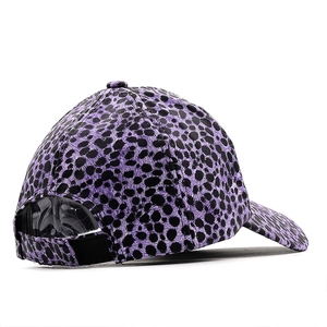 Detail view of purple leopard print baseball cap featuring an adjustable velcro strap back