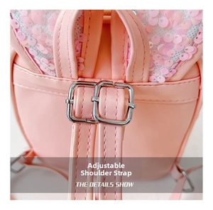 Close-up of adjustable pink sequin backpack straps with silver square metal buckles