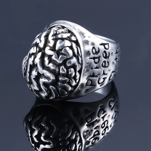 Macro view of brain structure texture and Pride engraving on punk stainless steel ring