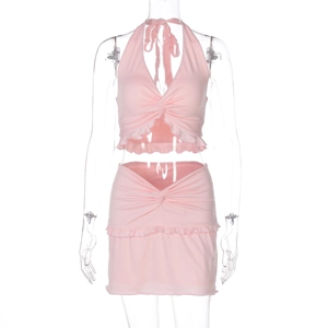 Detailed front view of pink halter twist top and matching ruffled mini skirt set on mannequin