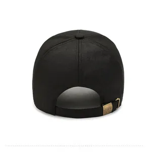 Rear view of black cotton baseball cap showing adjustable bronze Sport metal buckle