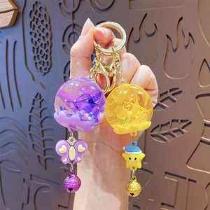 Cute acrylic oil-filled butterfly and star keychains with charms and gold metal rings