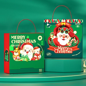 Christmas gift bags with festive Santa and reindeer designs on a green platform