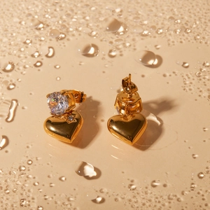 18k gold plated heart earrings with round zircon and star detail on water droplet surface