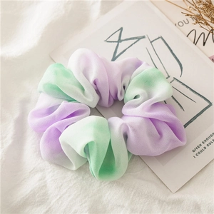 Detail of lavender and mint green gradient chiffon scrunchie with soft pleated texture