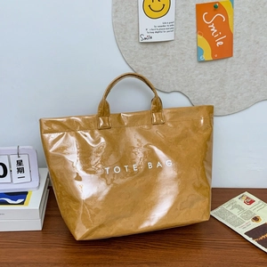 Glossy caramel Dupont tote bag with large capacity and minimalist waterproof finish