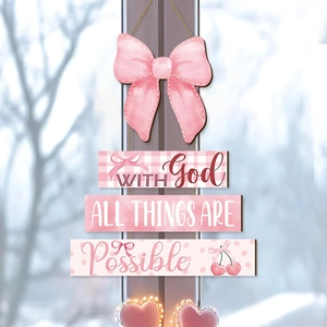Pink wooden wall hanging with bow and cherry patterns and inspirational religious text