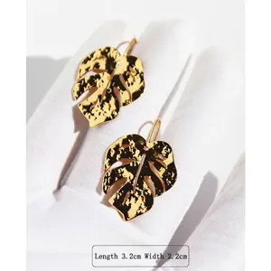 Gold monstera leaf earrings with hollow design measures 3.2cm length and 2.2cm width