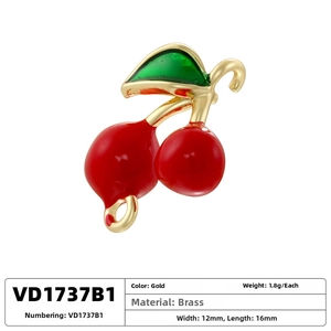 Detail of red cherry pendant charm made of brass with gold plating and size dimensions