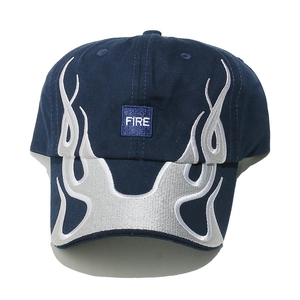 Detail of navy blue baseball cap featuring gray fire embroidery and blue FIRE patch