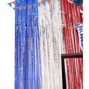 Red white and blue tinsel curtain backdrop with USA flag star banners for party decor