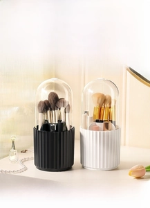 Detailed view of rotating makeup organizer with dustproof lid in black and white colors