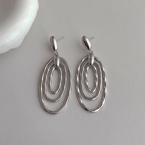 Chic silver layered oval drop earrings with minimalist polished triple ring design