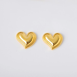 Vintage gold heart stud earrings with a polished finish on a clean white background