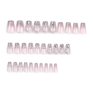 French cat eye press-on nails with pink glitter gradient and rhinestone pearl decor