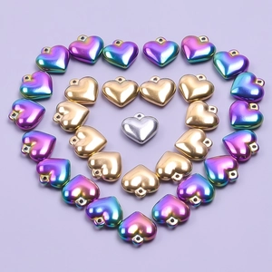 Three-layer heart pendants in rainbow, gold, and silver finishes made of durable steel