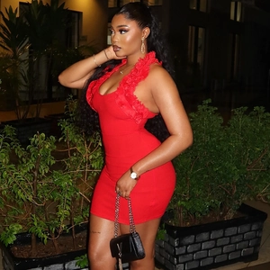 Detail of red sleeveless bodycon mini dress with elegant ruffle neckline and slim fit