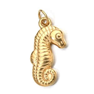 Detailed close-up of a golden seahorse pendant showing intricate metallic texture