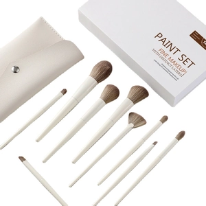 10pcs makeup brush set with beige handles and brown bristles in a matching storage bag