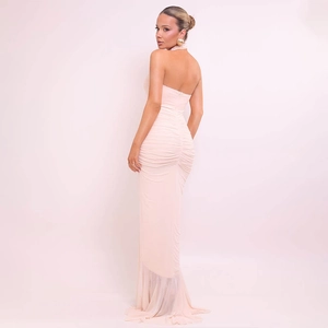 Detail of light pink backless maxi dress with halter neck and pleated ruching textures
