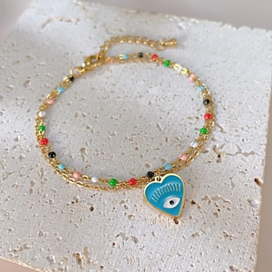 Double-layered gold chain bracelet with multicolor beads and blue heart evil eye charm