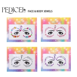 Close-up of multicolored acrylic face jewels in heart and round shapes for costume makeup