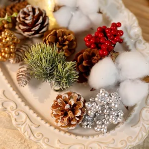 Christmas decoration kit with pine cones, cotton, berries and pine needles in a white tray