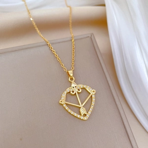 Elegant gold titanium heart Cupid pendant necklace with sparkling zircons on silk base