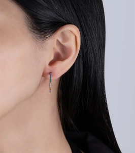 Close-up of model wearing rainbow zircon earrings in 14k gold plated 925 sterling silver