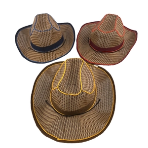 Detail view of woven straw cowboy hats with blue, red, and yellow decorative trim edges