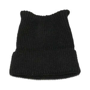 Detail of black knit cat ear beanie with vertical ribbing and wide folded cuff