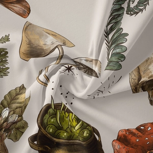 Detailed fabric macro showing mystical mushroom and botanical prints on soft textile