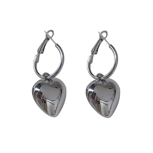 Silver metallic heart drop earrings with polished hoop closure in minimalist style