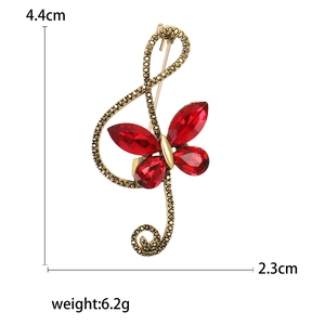 Vintage bronze treble clef brooch with red rhinestone butterfly and size dimensions