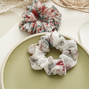 Close-up of floral scrunchies set with soft fabric texture and vintage patterns