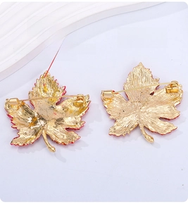 Detail of maple leaf brooch back showing dual-purpose safety pin and pendant loop