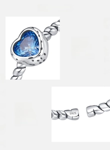 Detailed close-up of S925 sterling silver twist band with a 5A blue heart zircon stone
