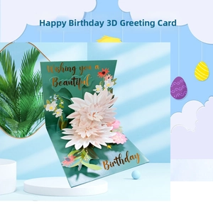 Macro detail of 3D pop-up flower card with gold stamped lettering and floral layers