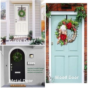 Dual black iron wreath hanger shown on wood, glass, and metal doors for seasonal decor
