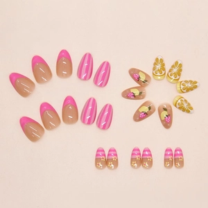 Detail of press-on nails featuring 3D strawberry lemon art and pink French tip patterns