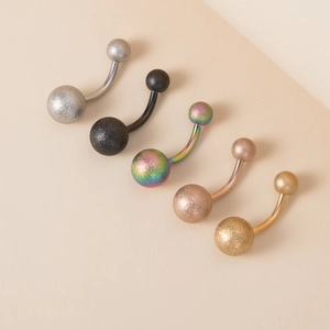 Five pieces of matte stainless steel belly button rings in silver, black, and gold colors
