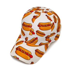 Close-up of white cotton baseball cap featuring colorful cartoon hot dog pop art patterns