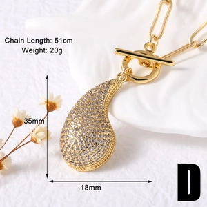 Detail view of gold heart pendant with zircon stones and clip chain measurements